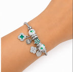 PULSERA PLATEADA CON DIJES
