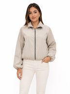 CHAQUETA CORTAVIENTOS DE CREMALLERA Y CUELLO ALTO